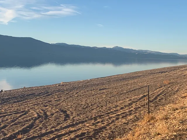 Mountain view featuring a nearby body of water