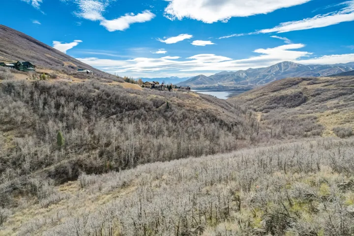 Mountain view featuring a nearby body of water