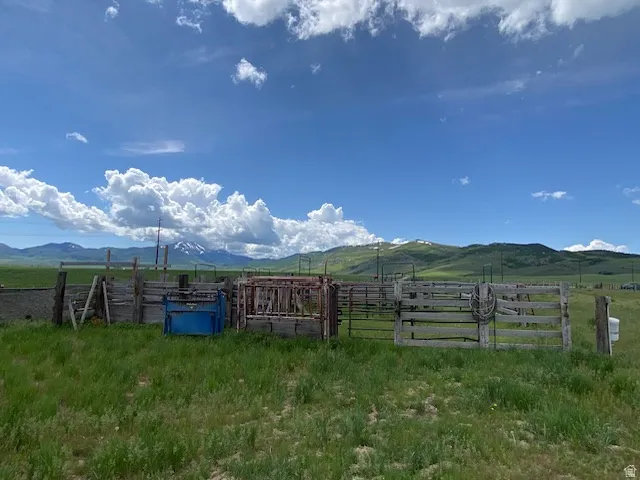 View of yard featuring a view of rural / pastoral area and a mountain view