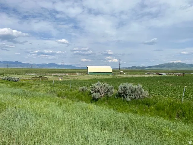 View of mountain background featuring rural landscape