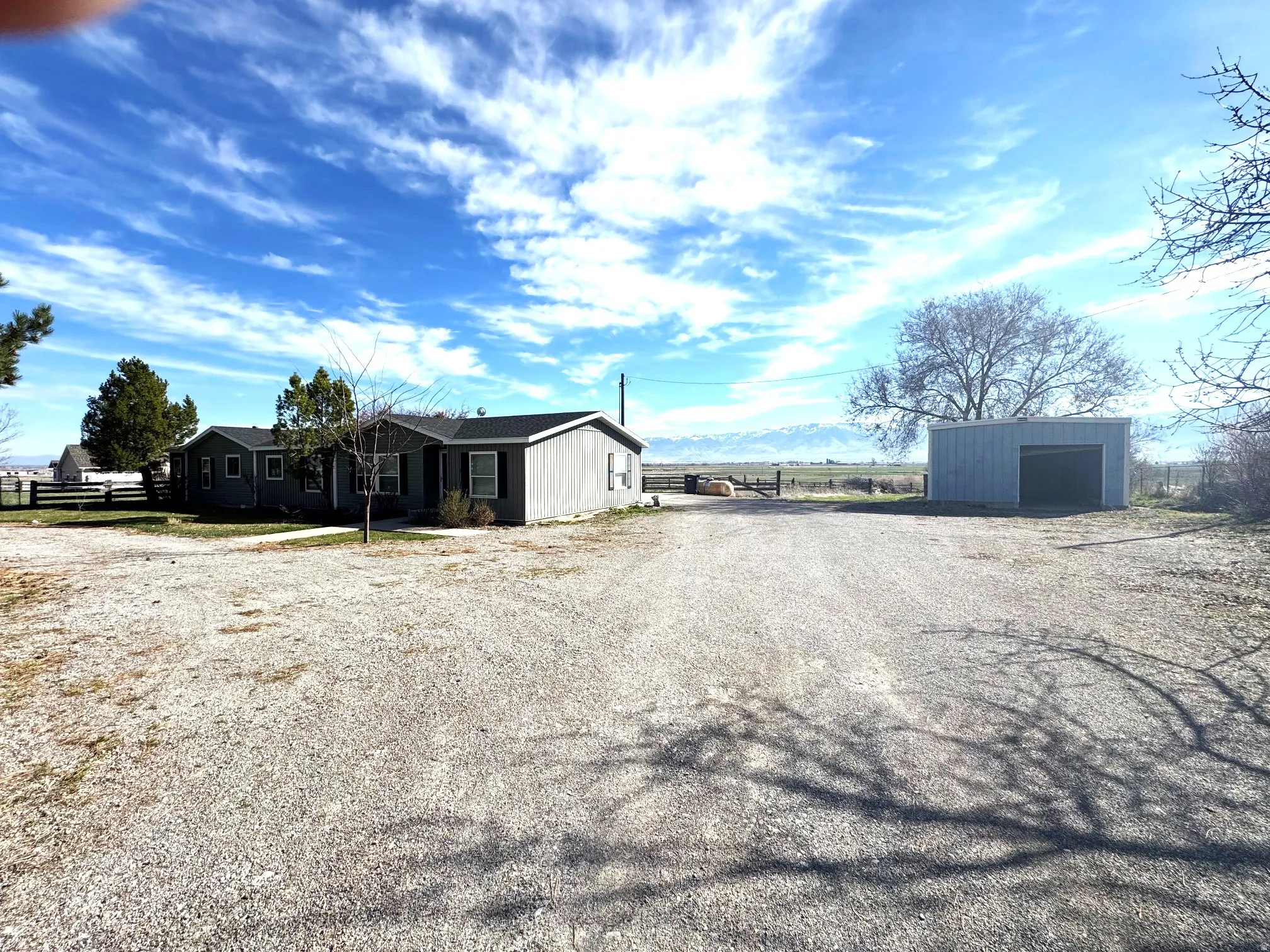 View of dirt / gravel driveway featuring a mountain view