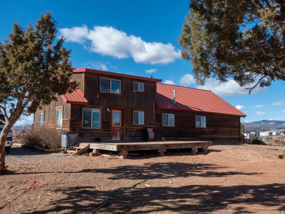 Rear view of house featuring a metal roof and a mountain view
