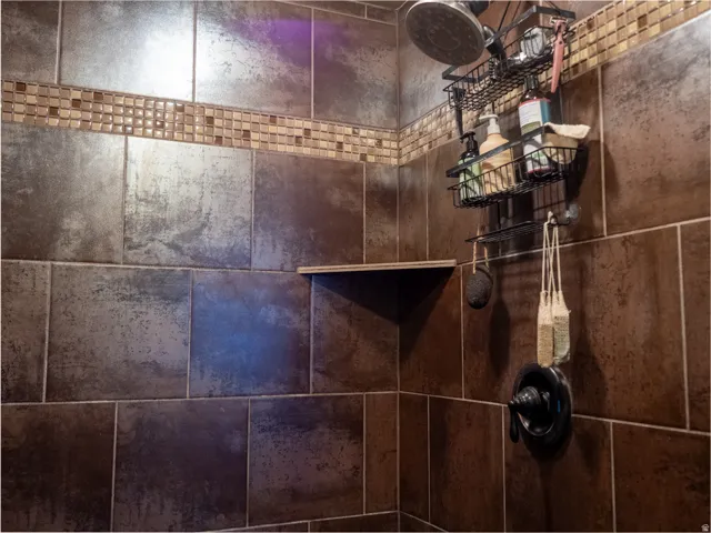 Bathroom view of a tile shower