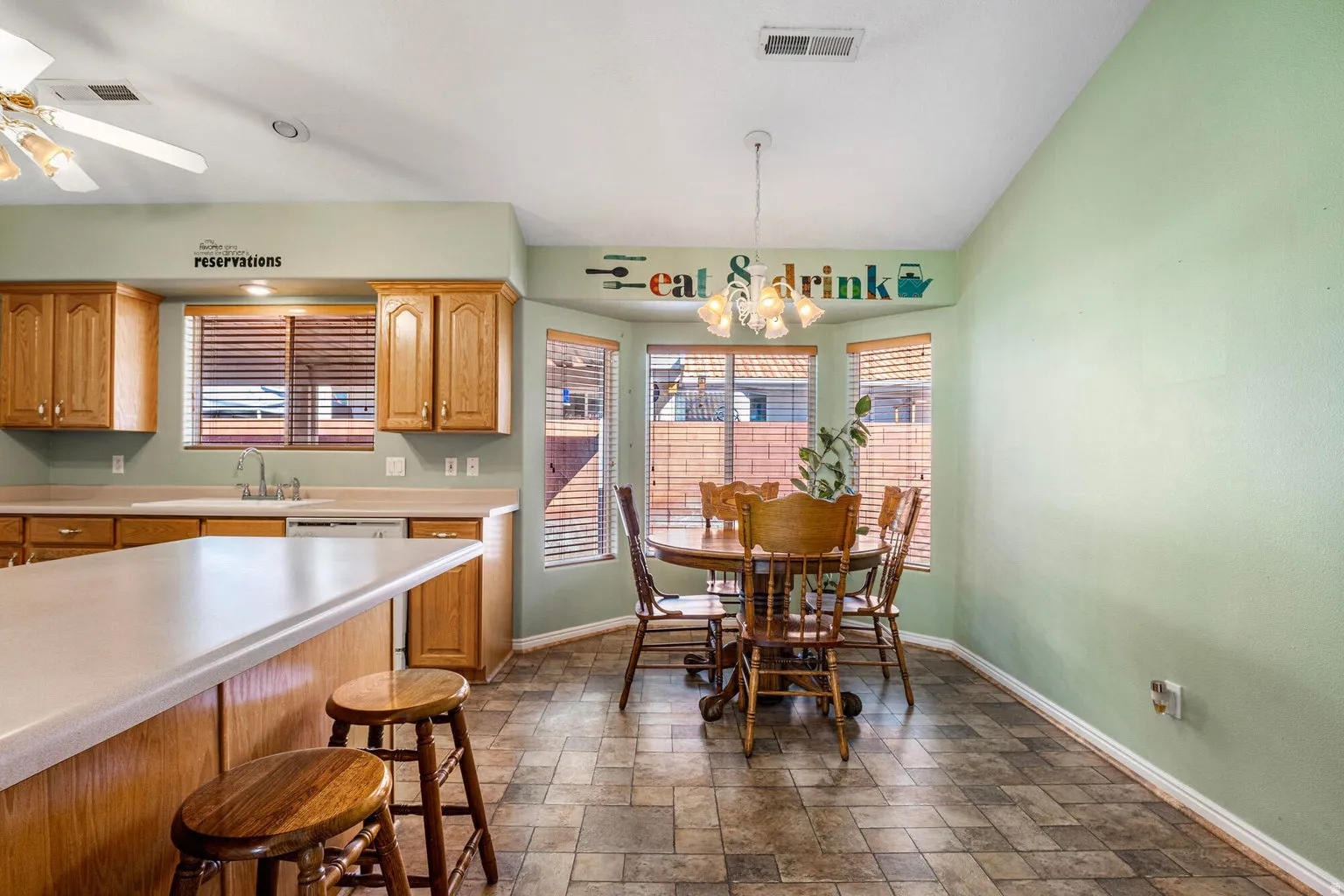 Large Dining area with large bay windows.