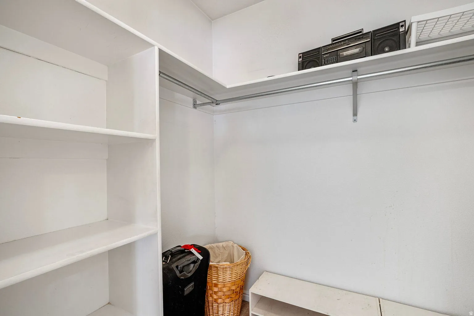 Walk in closet in primary bedroom