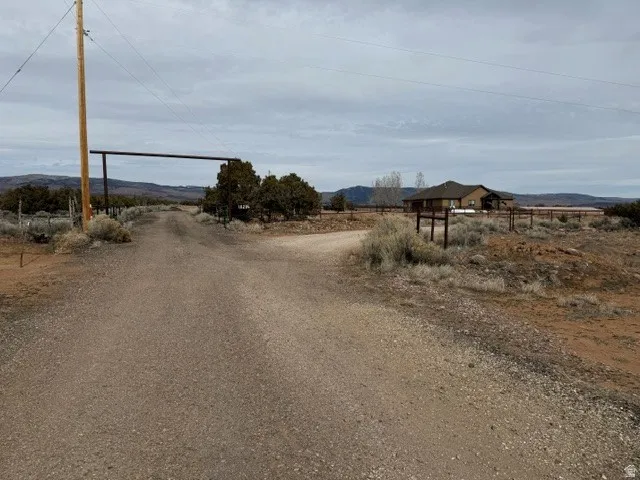 View of road with a view of rural / pastoral area and a mountain view