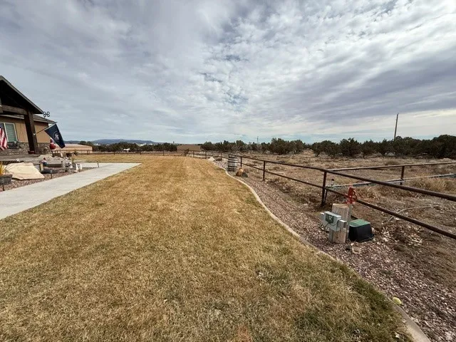 View of yard with a rural view and a patio