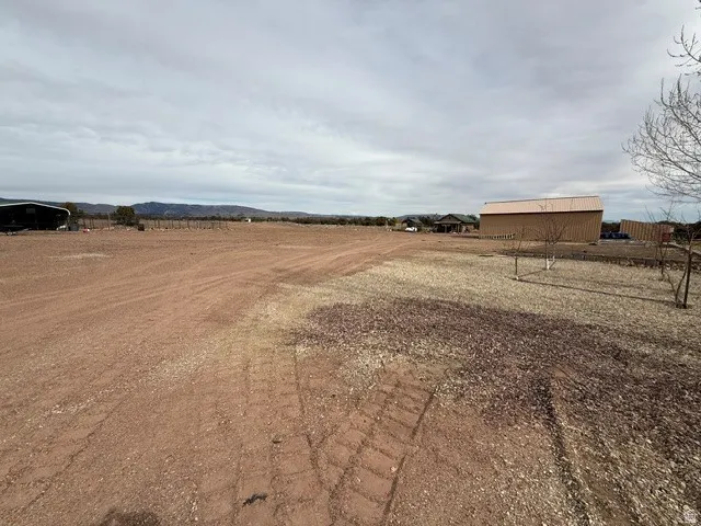 View of yard with a rural view
