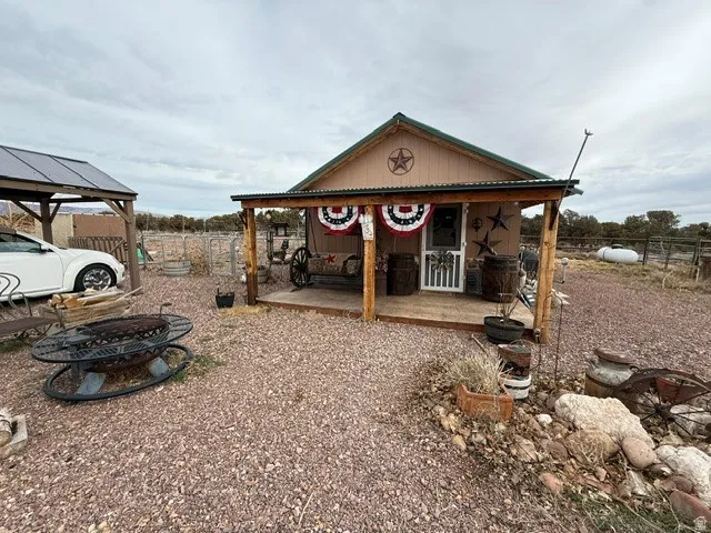 View of outbuilding with an outdoor fire pit