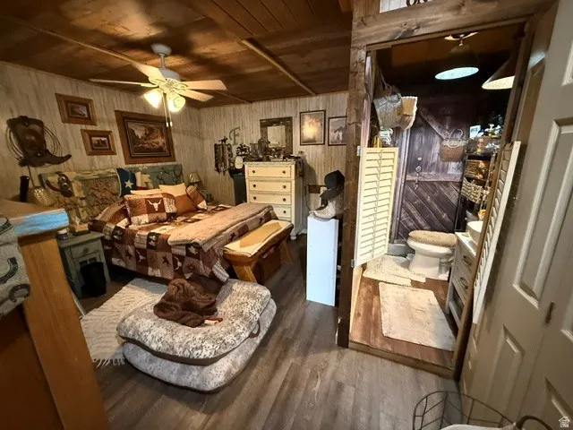 Bedroom with dark wood-type flooring