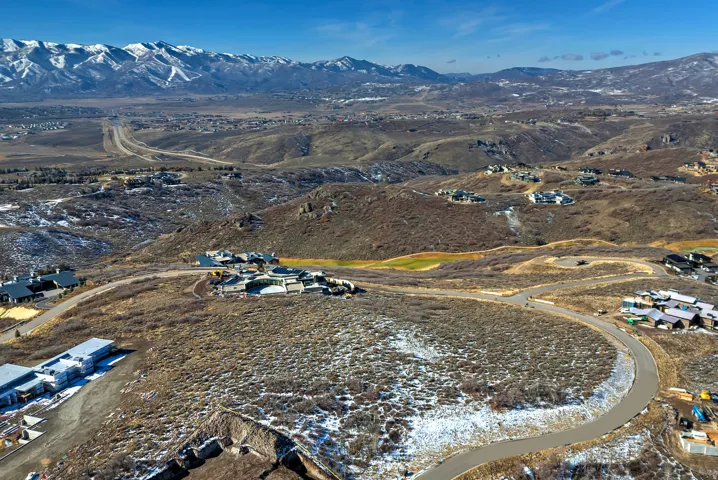 Aerial view of property's location with mountains