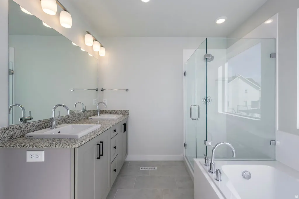 A spa-like retreat where you can soak away the day or refresh with a quick shower. *Spec photo. Colors and finishes will be different.