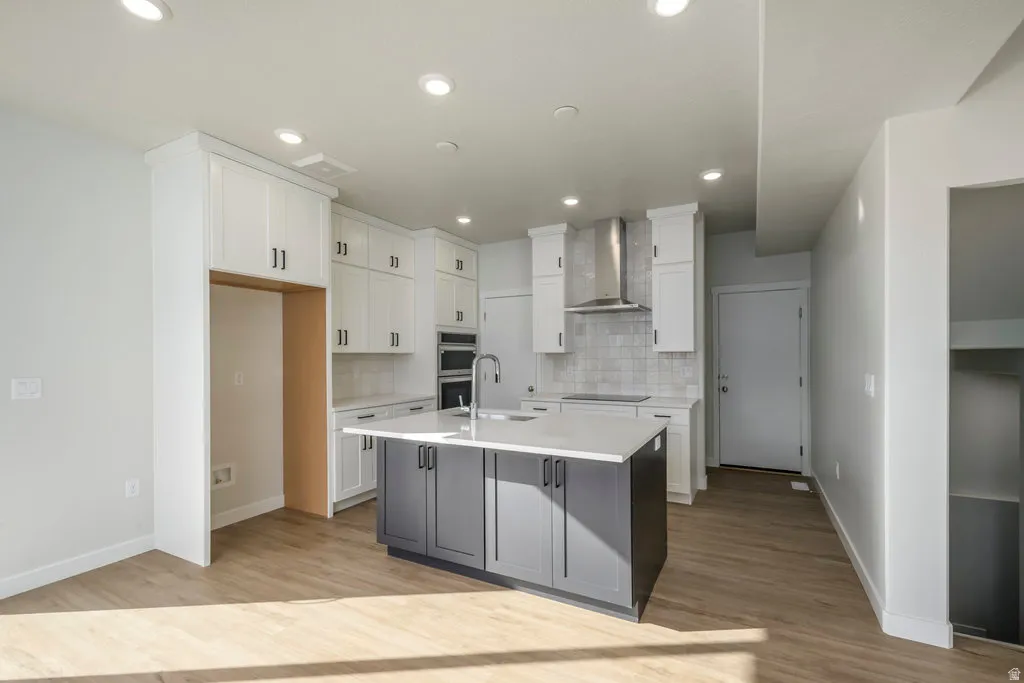 Imagine preparing dinner while still being part of the conversation around the table in this bright, open layout. *Spec photo. Colors and finishes will be different.