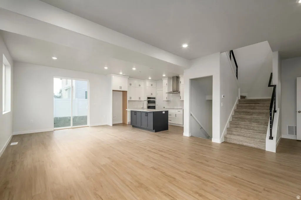 Imagine preparing dinner while still being part of the conversation around the table in this bright, open layout. *Spec photo. Colors and finishes will be different.