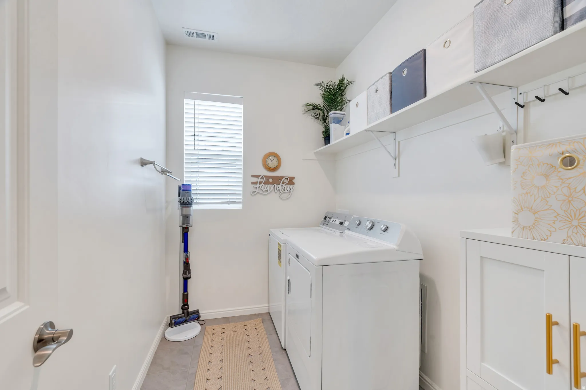 With additional cabinetry & shelving for storage