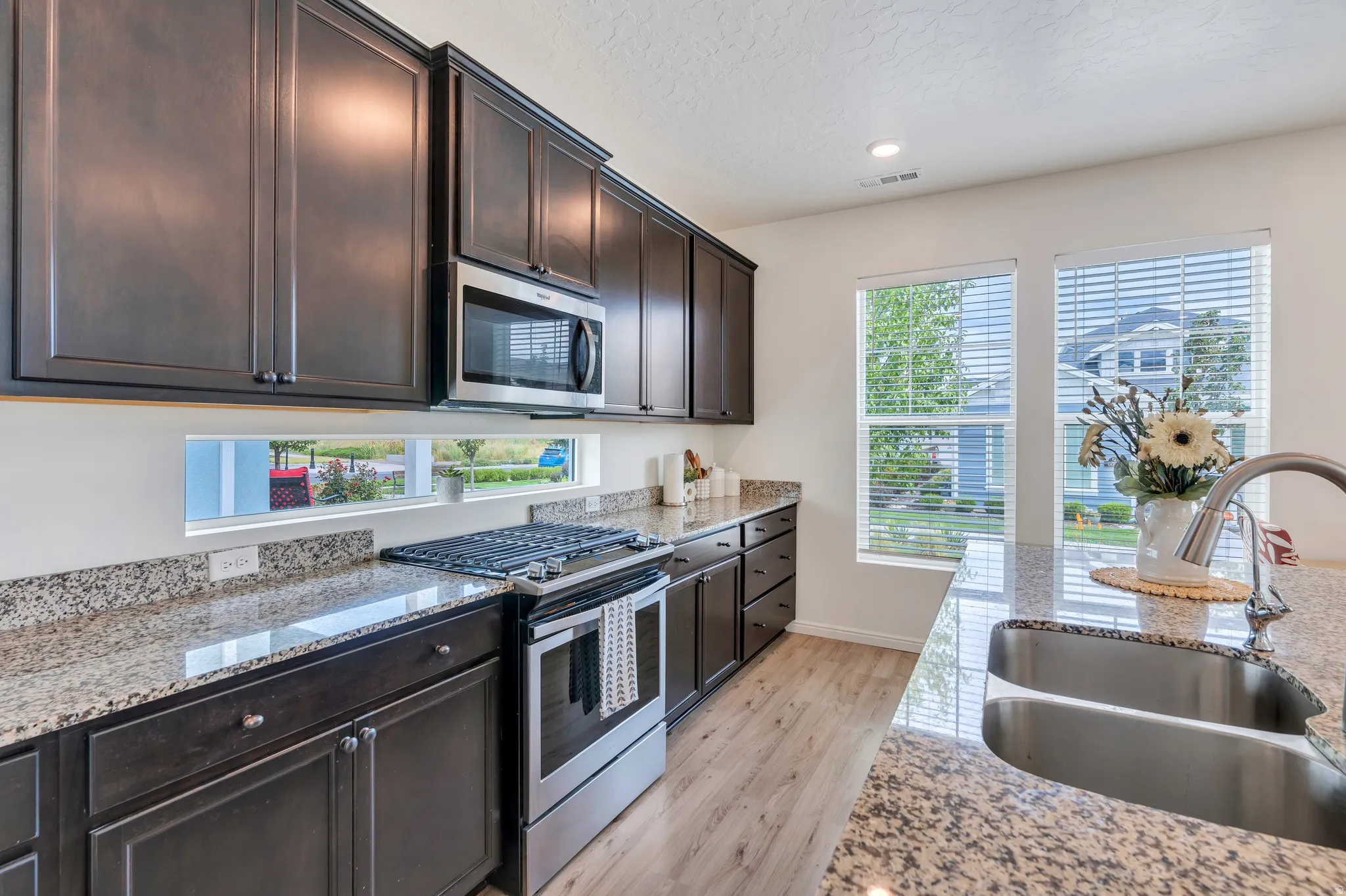 Rich cabinetry & granite countertops