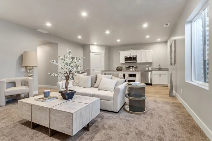 Living area featuring recessed lighting and light carpet