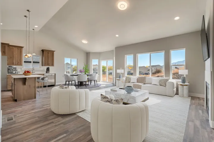 Living area featuring dark wood finished floors, recessed lighting, vaulted ceiling, and a fireplace
