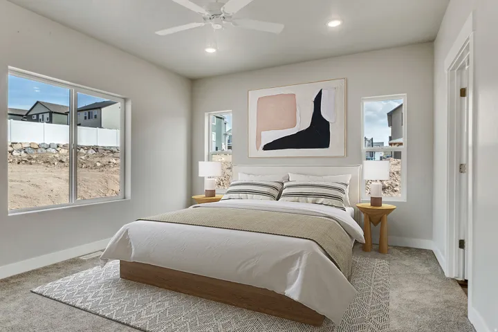Carpeted bedroom with ceiling fan and recessed lighting