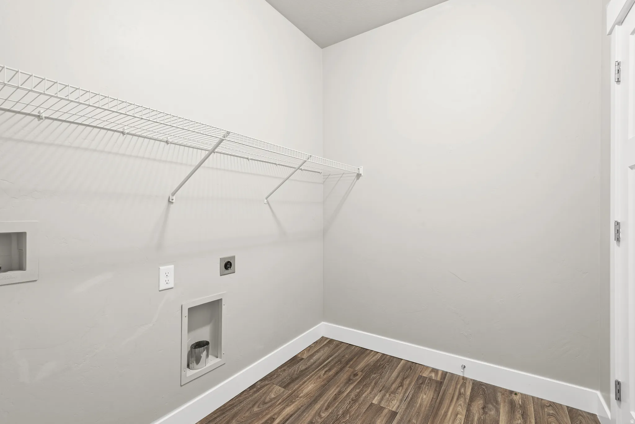 Laundry room featuring washer hookup, dark wood-style flooring, and electric dryer hookup