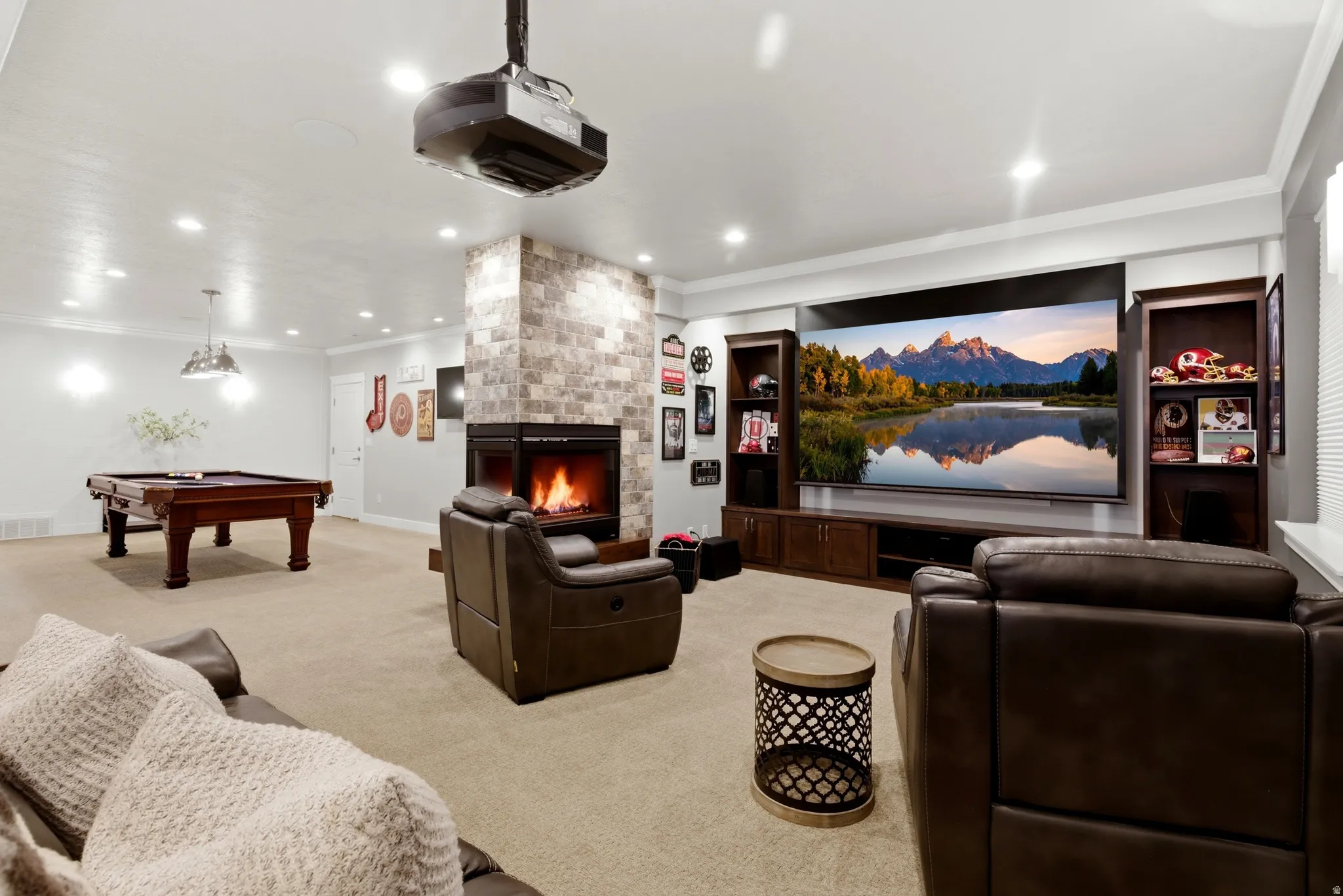 Cinema featuring crown molding, a fireplace, light carpet, billiards, and recessed lighting