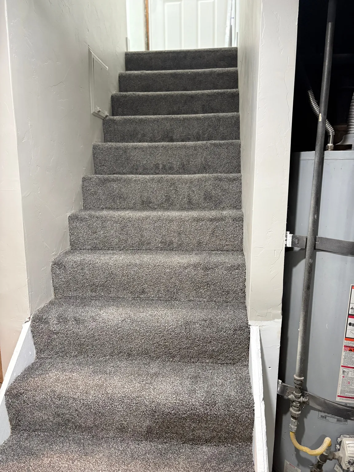 Staircase with secured water heater