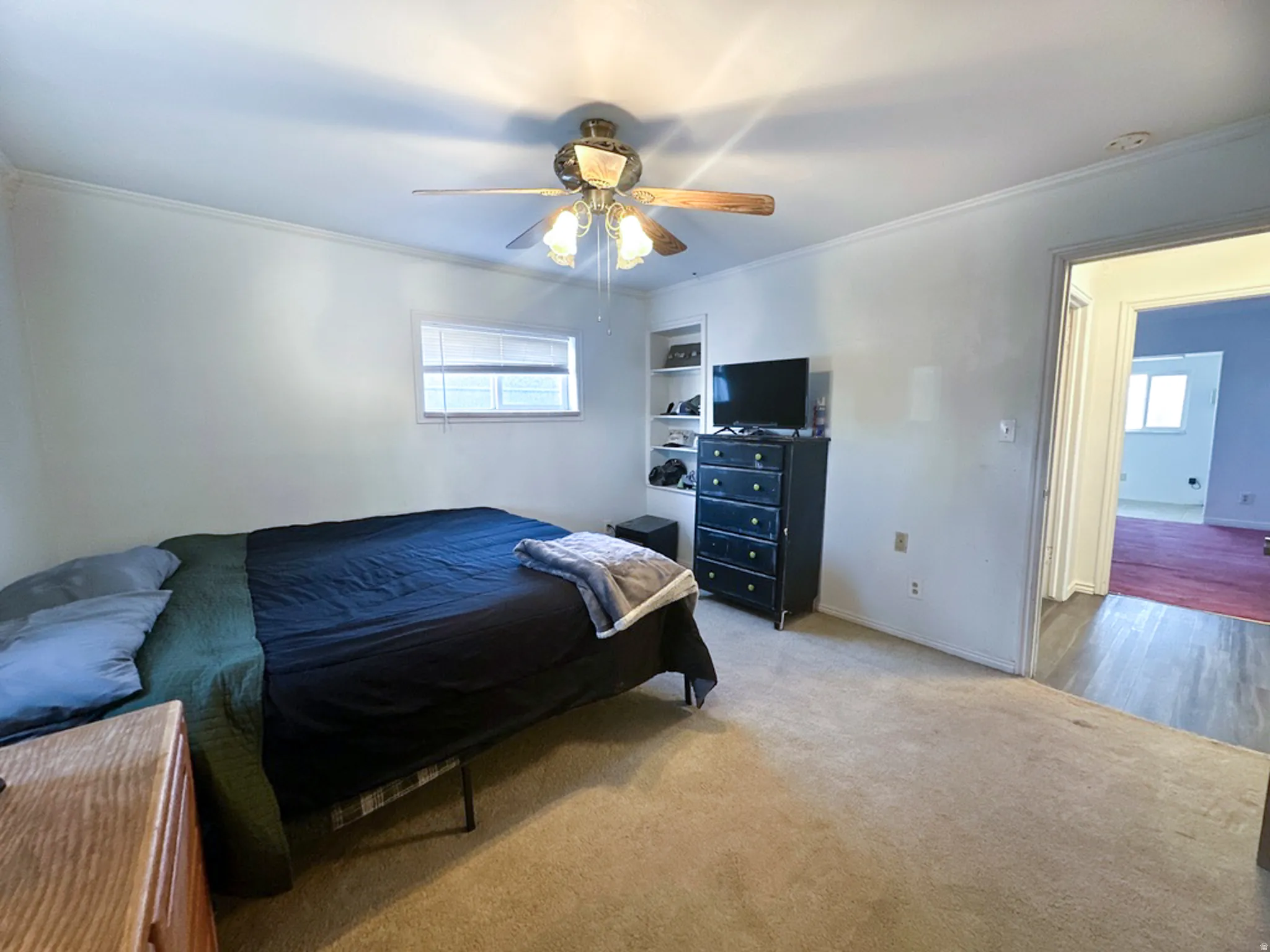 Bedroom with carpet floors and ceiling fan