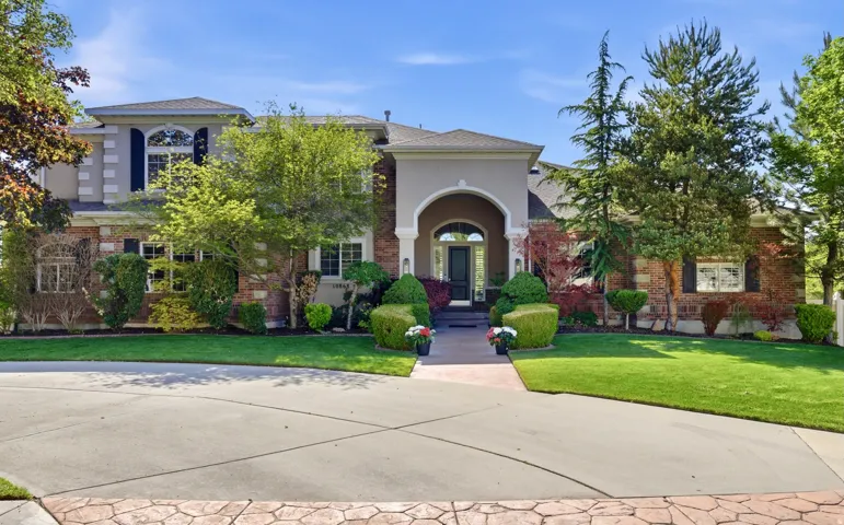 Stucco and brick exterior with arched entryway