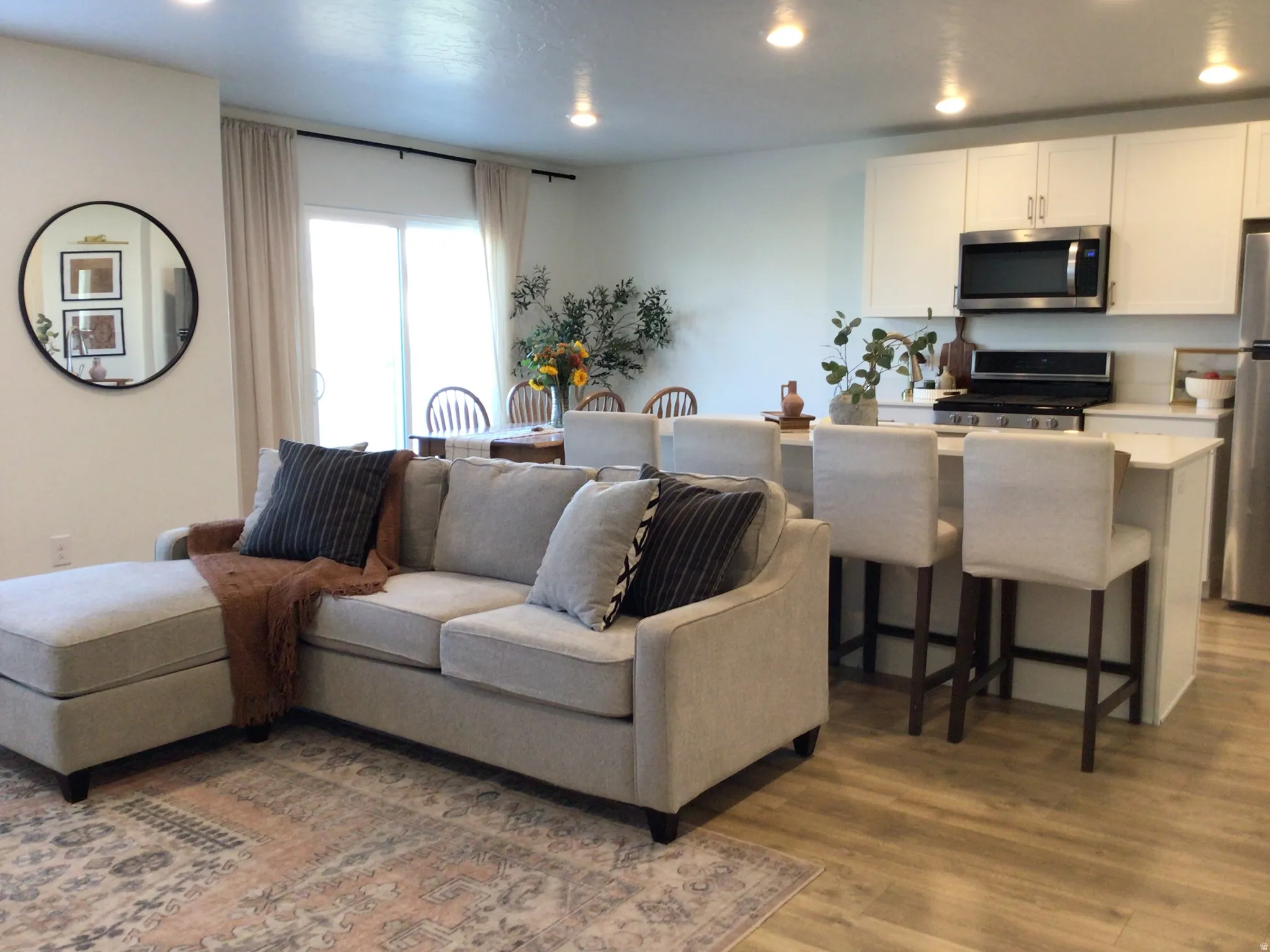 Living room featuring wood finished floors and recessed lighting