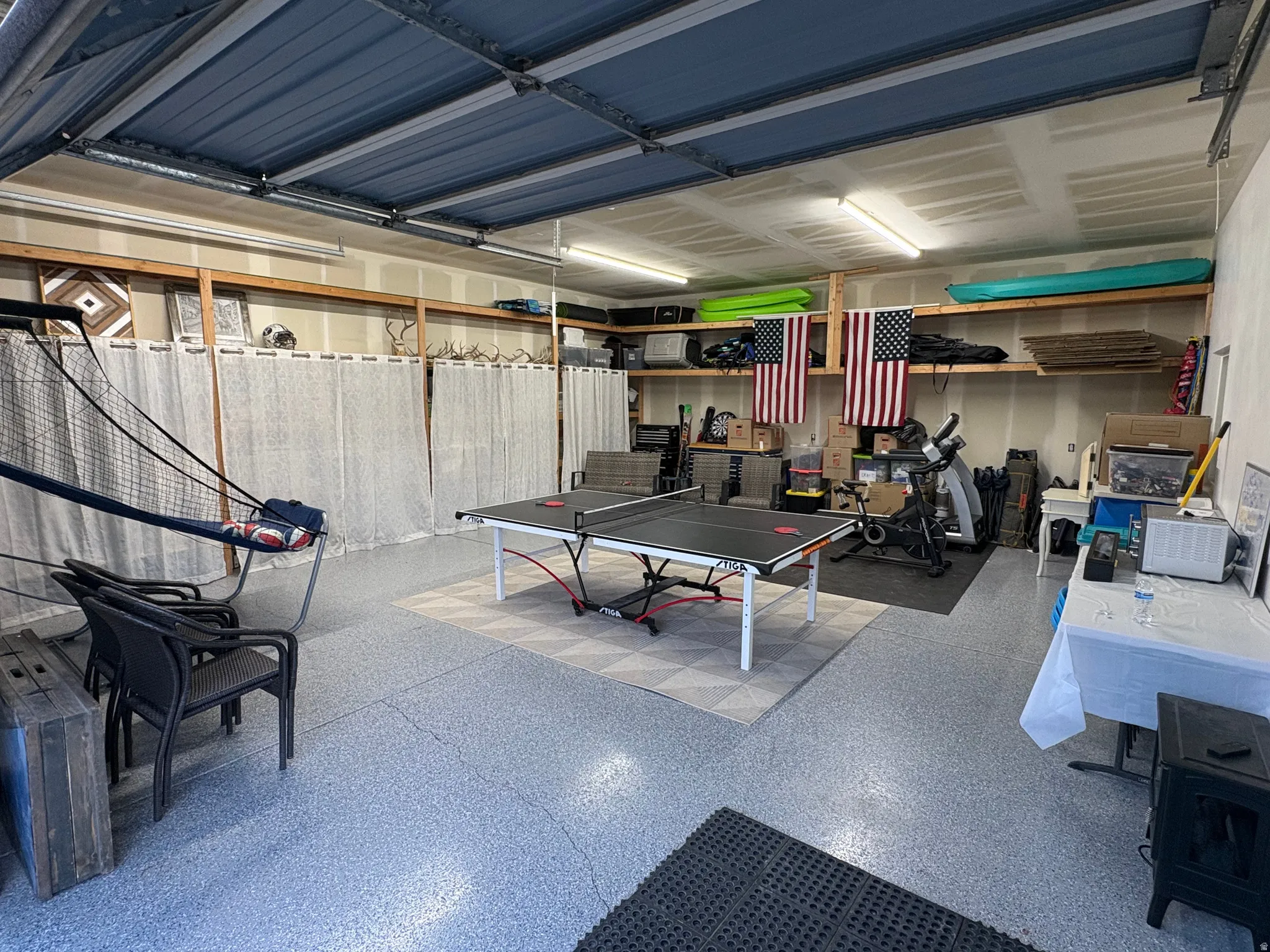Large detached shop for additional parking, storage, or workout/game area. New shelves for storage, a new electrical sub-panel, epoxy floor, and upgraded insulation.