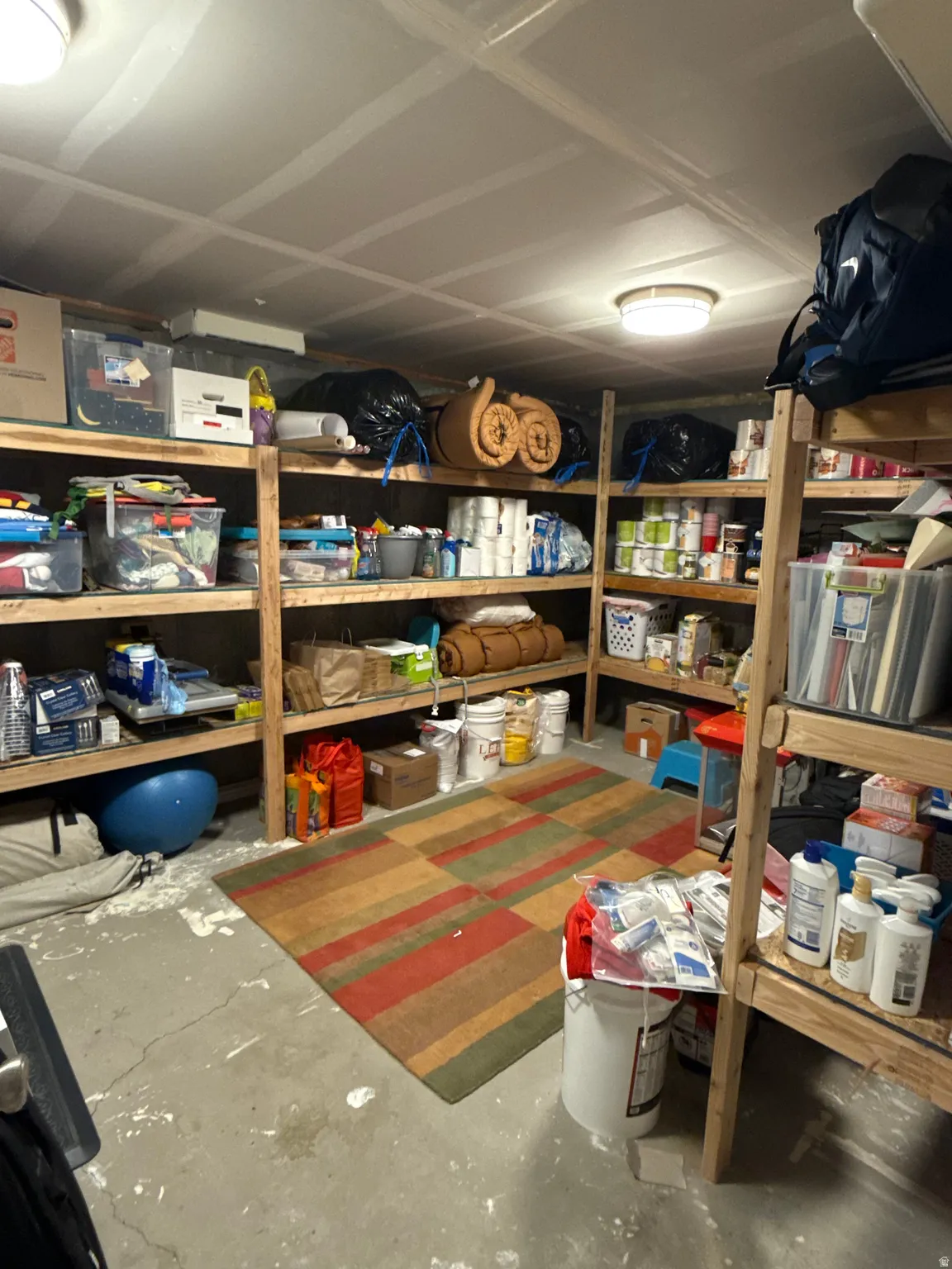 View of storage room with new shelves built for ease of organization.