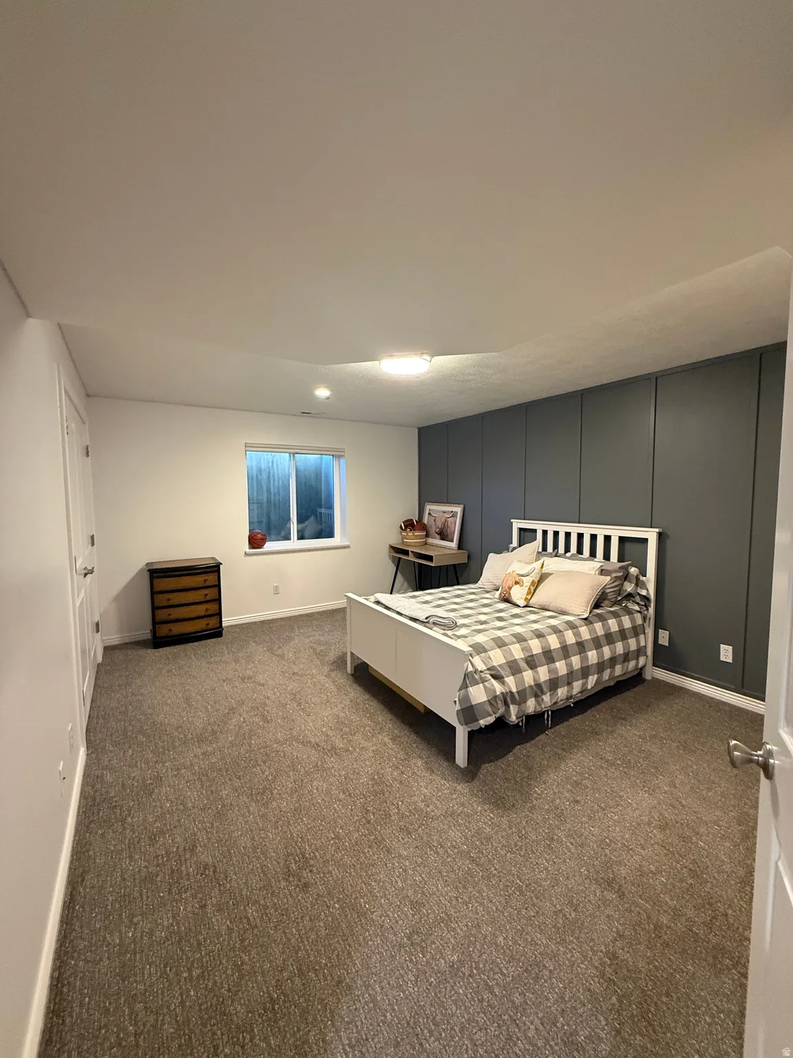 Bedroom 4 with updated carpet, closet doors, paint, and windows.