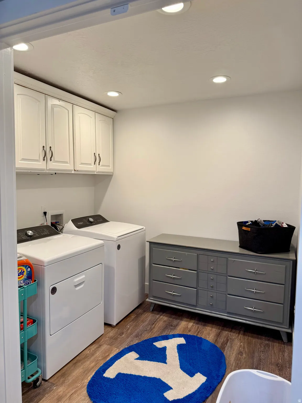 Second laundry room (new), featuring cabinets, updated flooring, and paint.