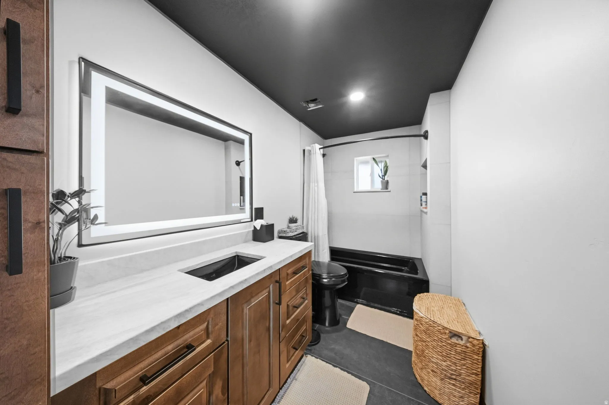 Full bathroom with vanity and shower / tub combo