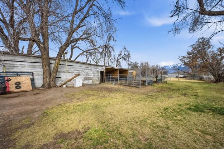 View of yard featuring an outdoor structure and an exterior structure