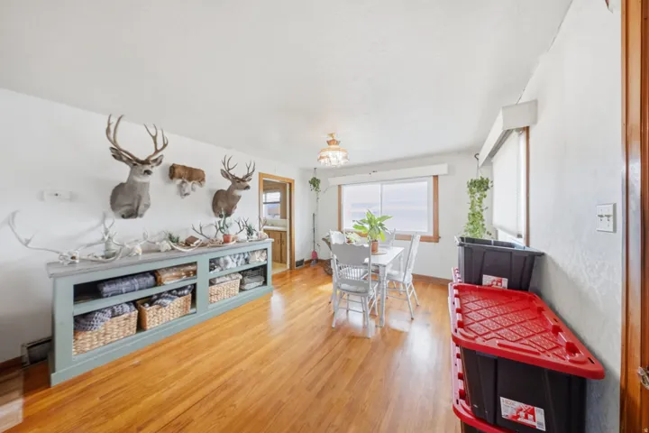 Dining space featuring light wood finished floors and baseboards