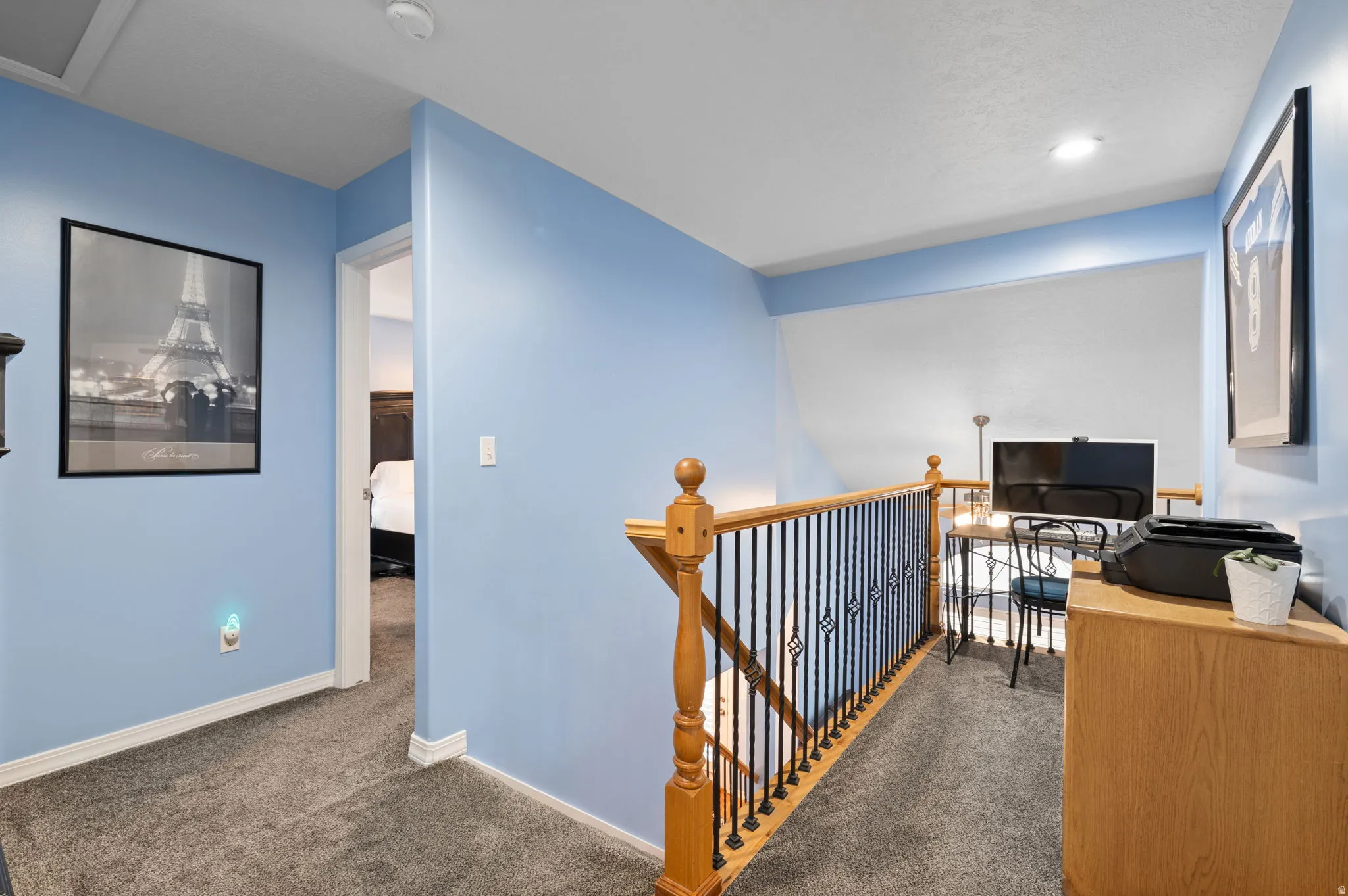 Flexible loft space—perfect for a home office or cozy reading retreat