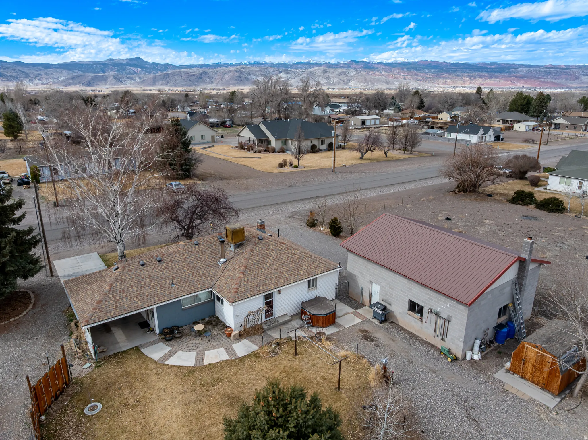 Aerial perspective of suburban area featuring a mountainous background