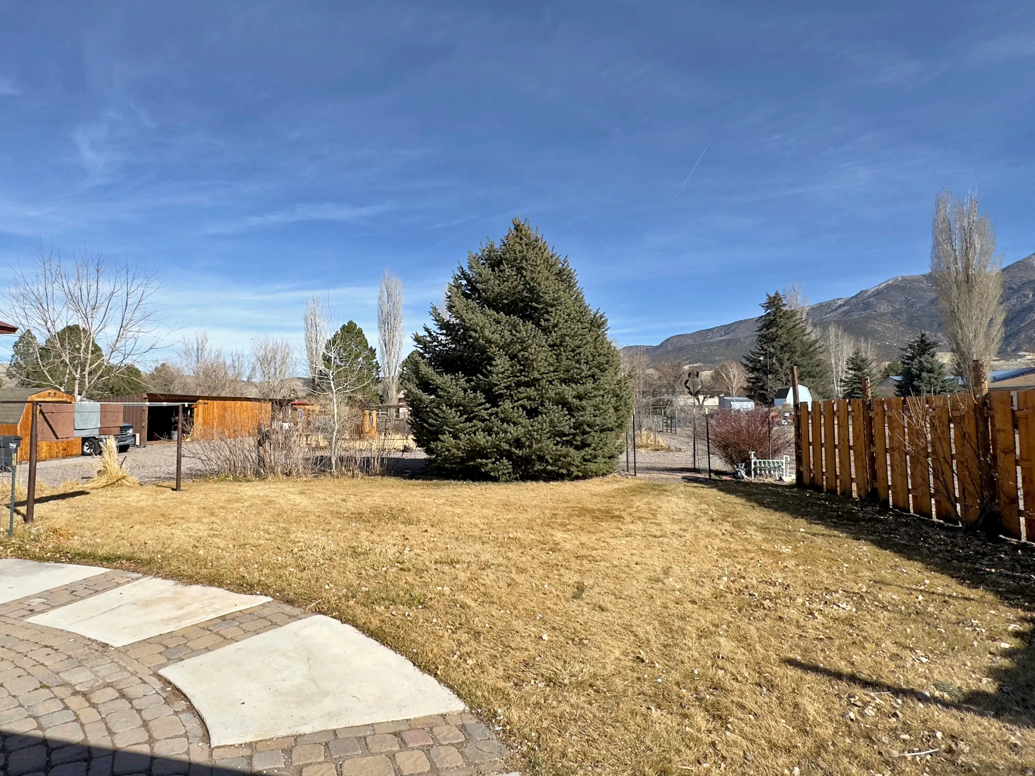View of yard featuring a gate and a mountain view