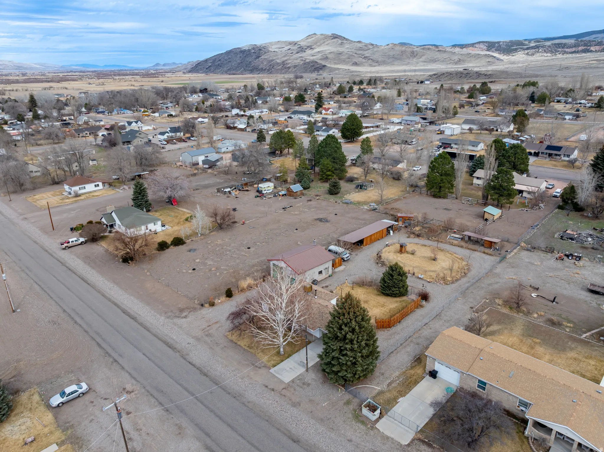 Aerial perspective of suburban area featuring a mountain backdrop
