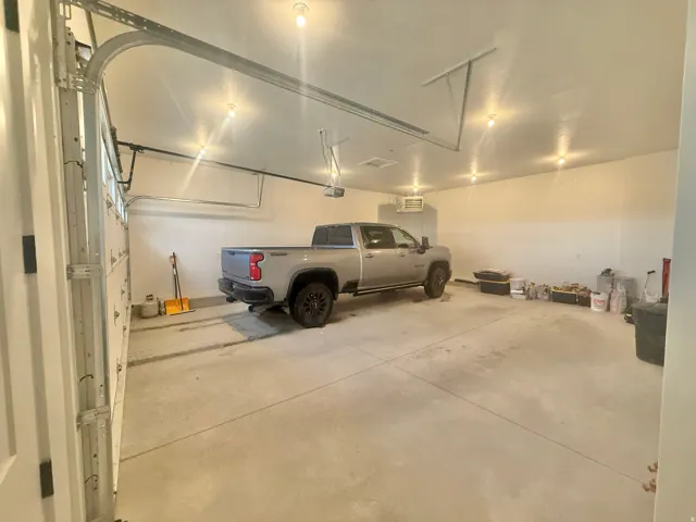 Garage featuring a heating unit