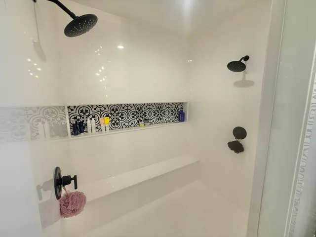 Bathroom featuring tiled shower