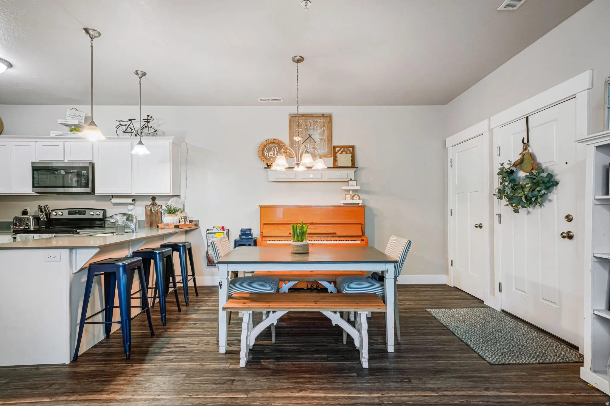 Dining room featuring baseboards and dark wood-style floors