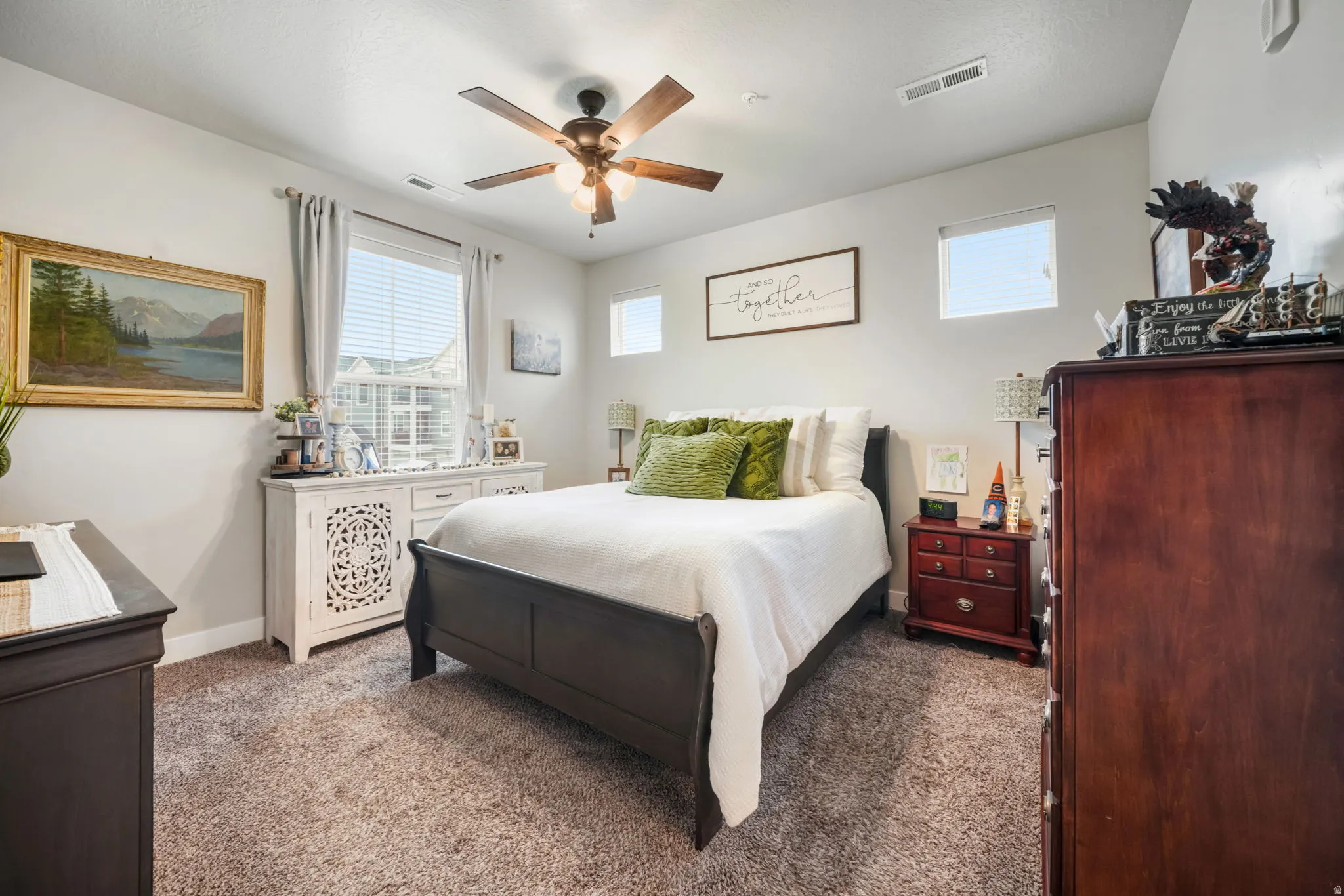 Bedroom with carpet and a ceiling fan