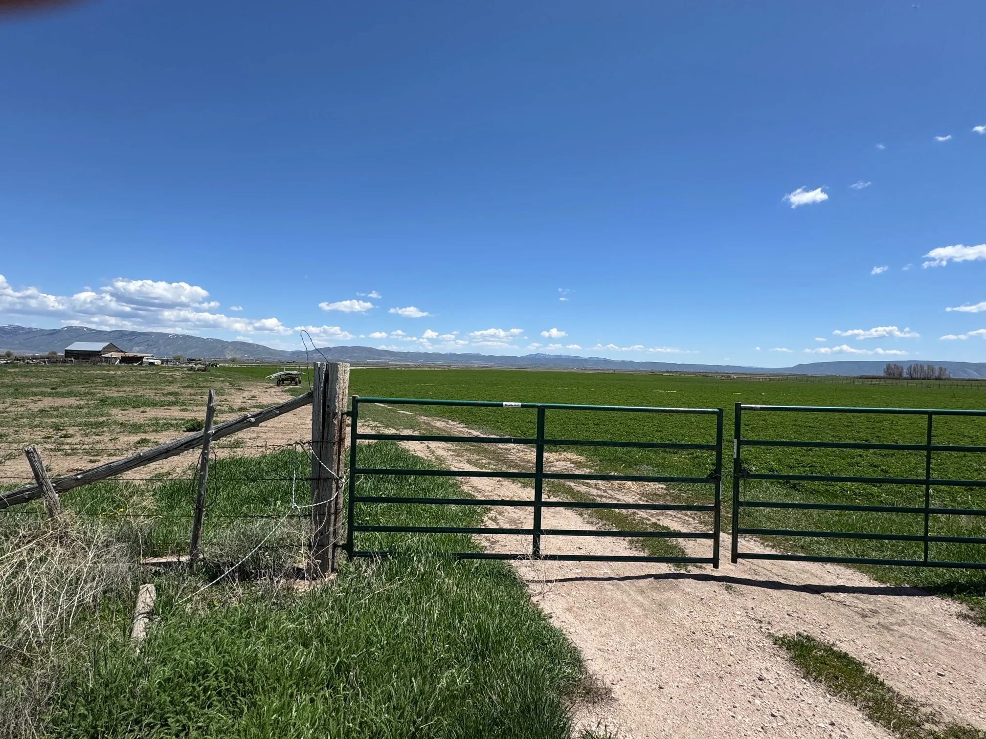 Gate with a view of rural / pastoral area and a mountain view