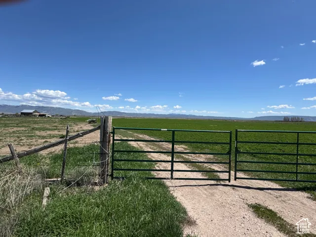 Gate with a view of rural / pastoral area and a mountain view