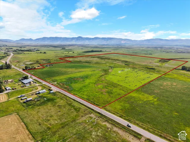 Expansive green landscape with a defined property boundary