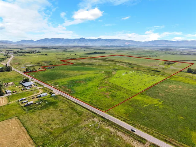Expansive green landscape with a defined property boundary