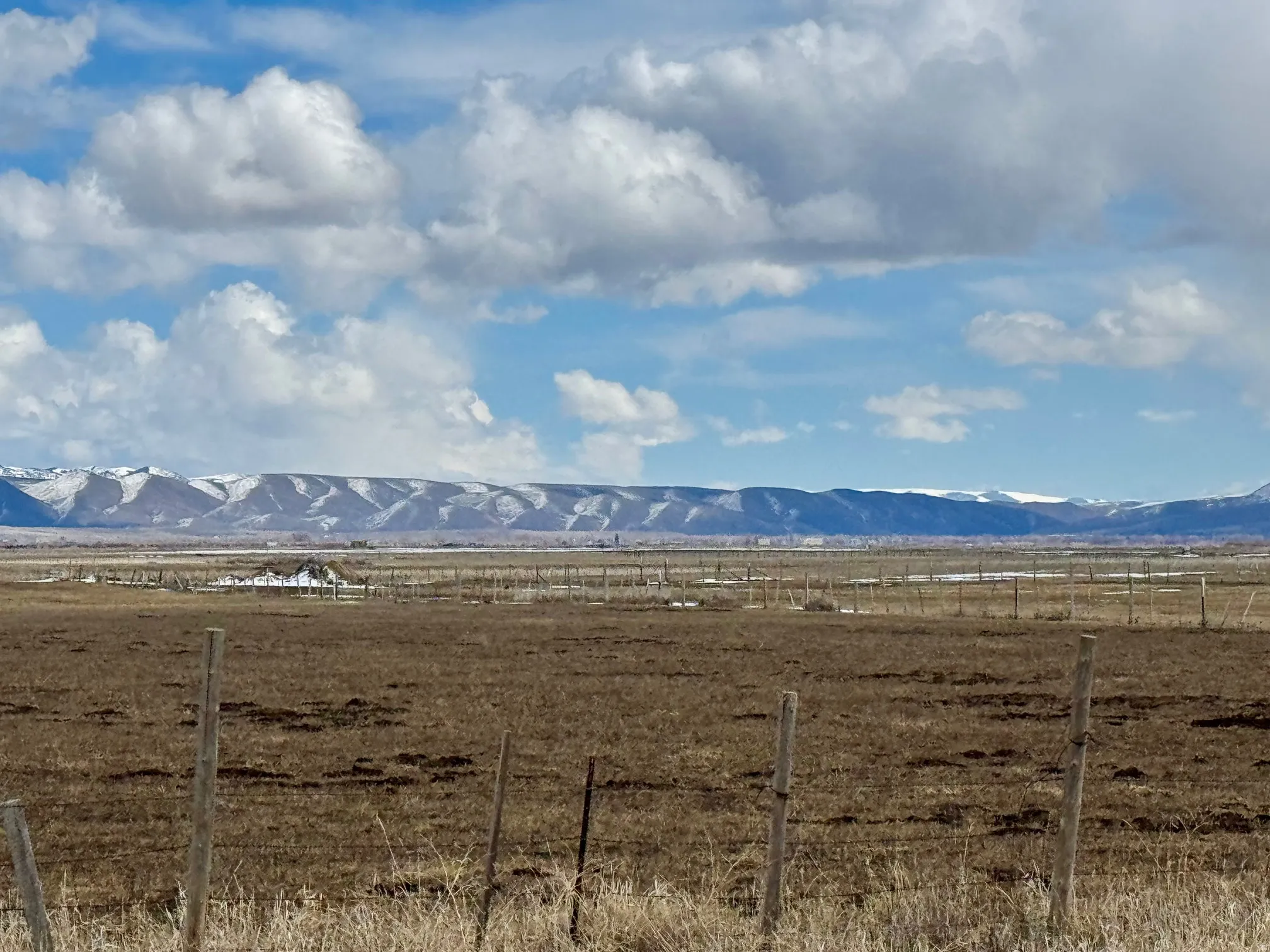 View of mountain backdrop featuring rural landscape