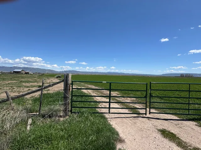 Gate featuring a rural view and a mountain view